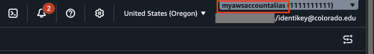 AWS console top right corner showing the account alias identifier highlighted within a red square in the navigation bar